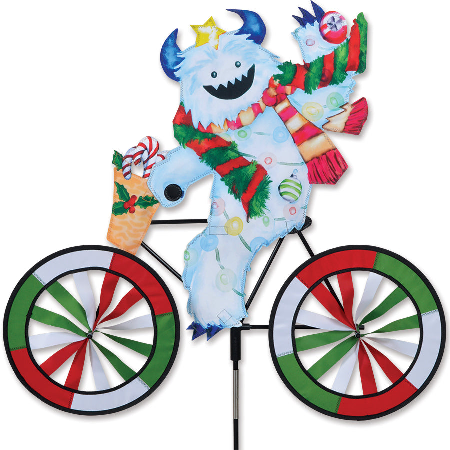 30 in. Bike Spinner - Yeti with wide six-panel fabric design spinning in a garden, showcasing a vibrant array of colors in motion.