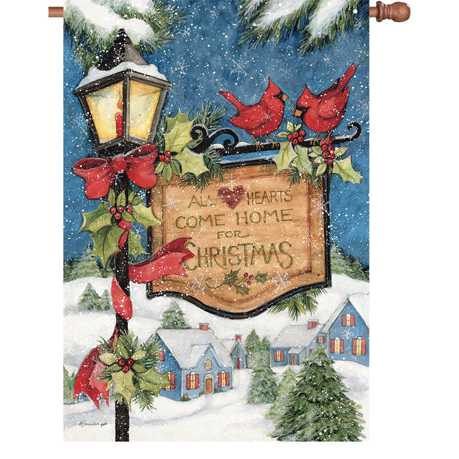 36 in. Elite Oversized House Flag featuring a Christmas lightpost, red bows, and cardinals, displayed on a flag pole in a winter setting.