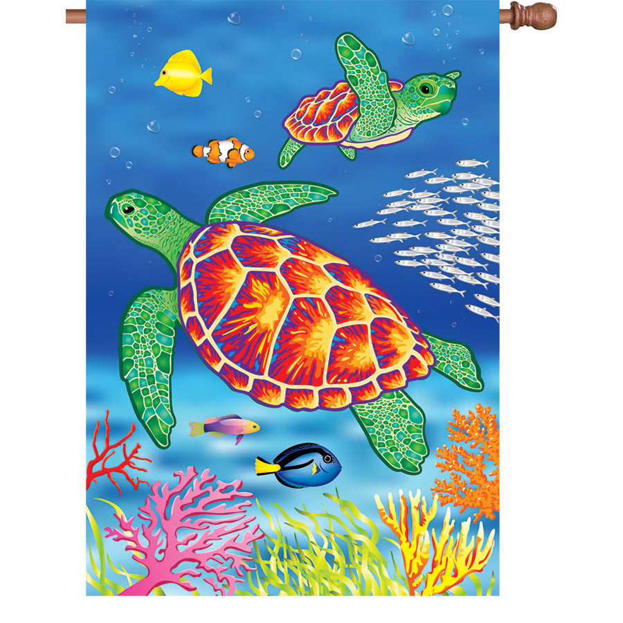 36 in. oversized house flag with vibrant sea turtles design, displayed on a standard flag pole, waving gently in a garden setting.