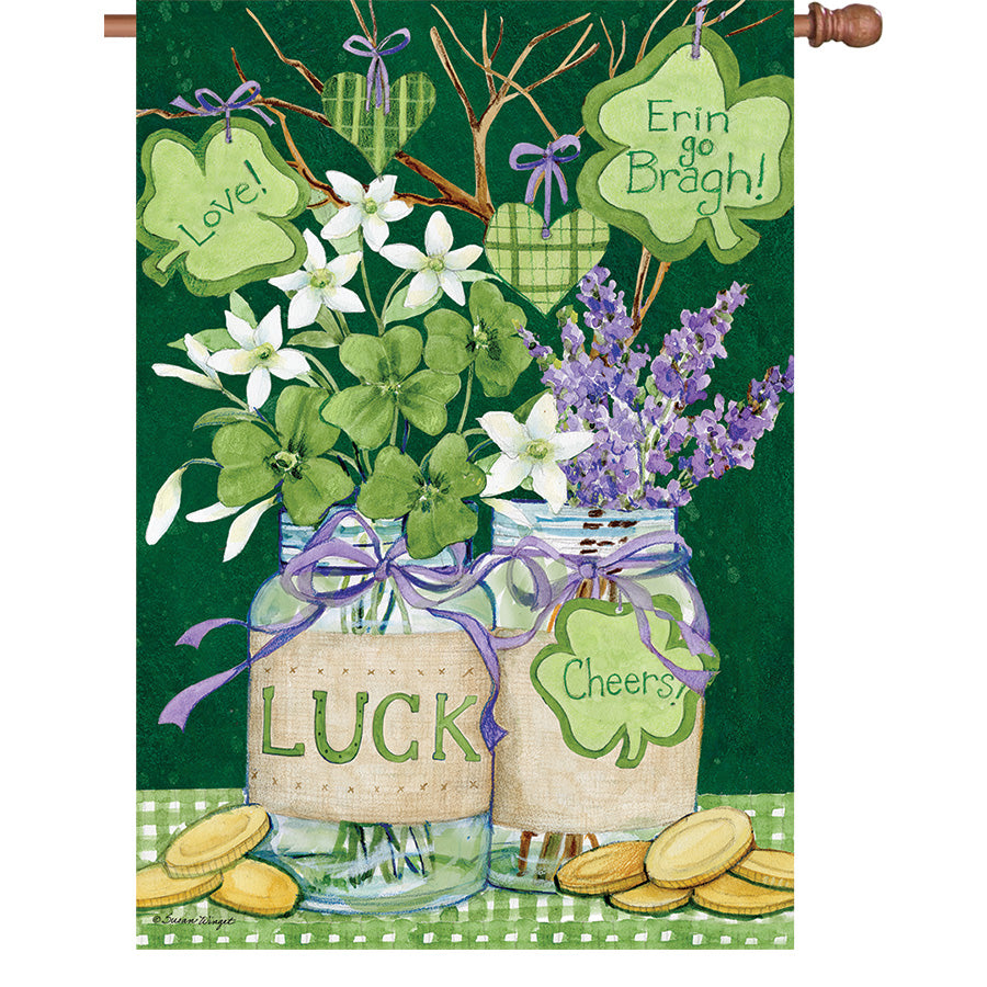 36 in. Elite Oversized House Flag featuring Shamrock Jars design displayed outdoors, enhancing a festive home garden setting.