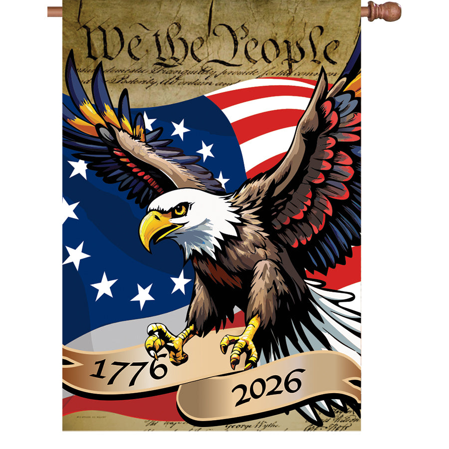 36 in. Elite Oversized House Flag featuring a patriotic eagle design and 'We the People' motto displayed on a flagpole in a garden setting.