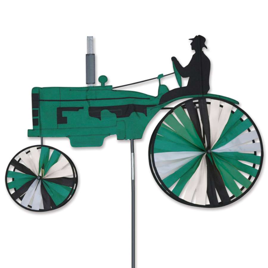 38 in. Tractor Spinner garden ornament in vibrant green, featuring a classic tractor design spinning in a gentle breeze amidst flowers.