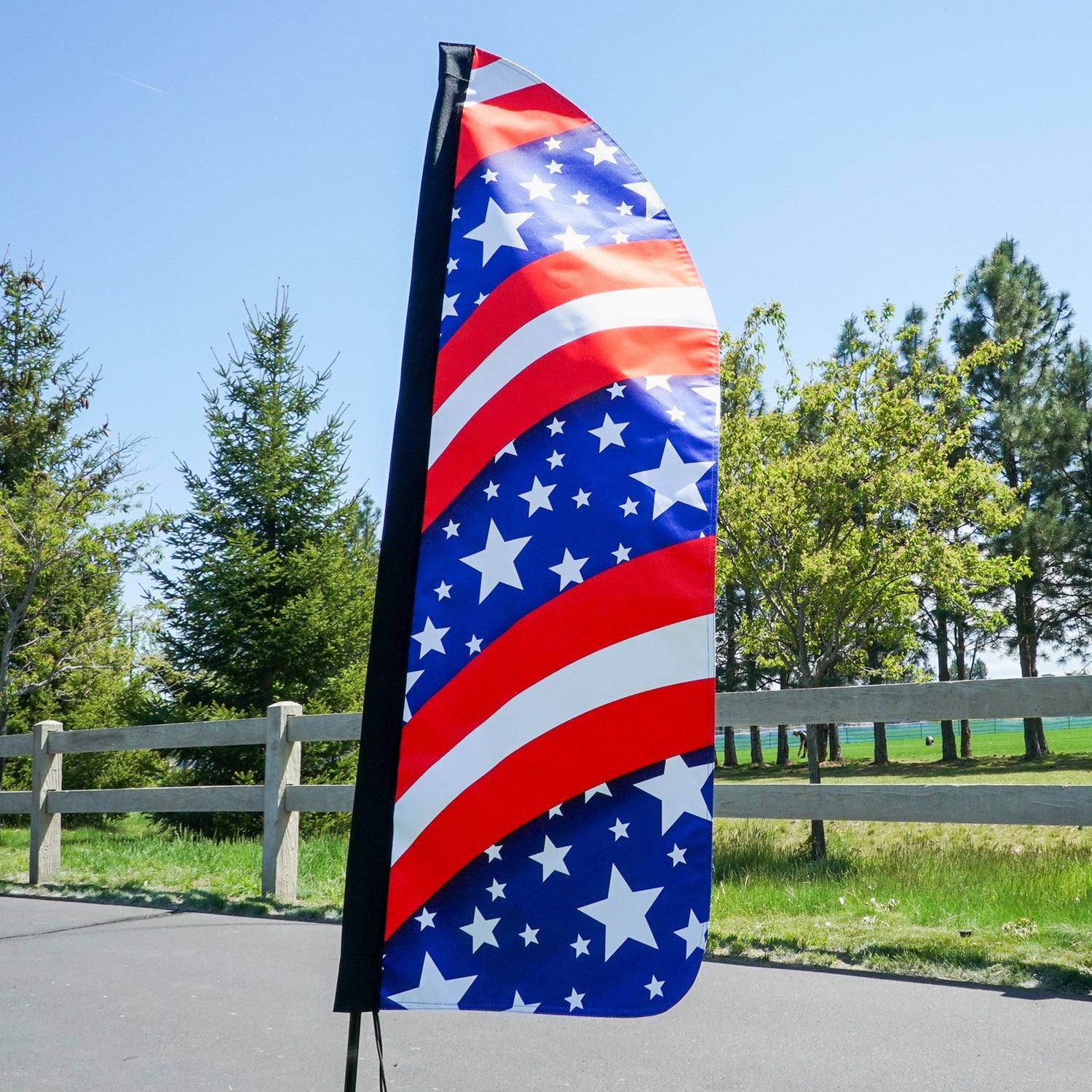 4-foot Heavy Duty Stars & Stripes Double-Sided Feather Banner proudly displaying the American flag colors, ideal for outdoor events and business use.