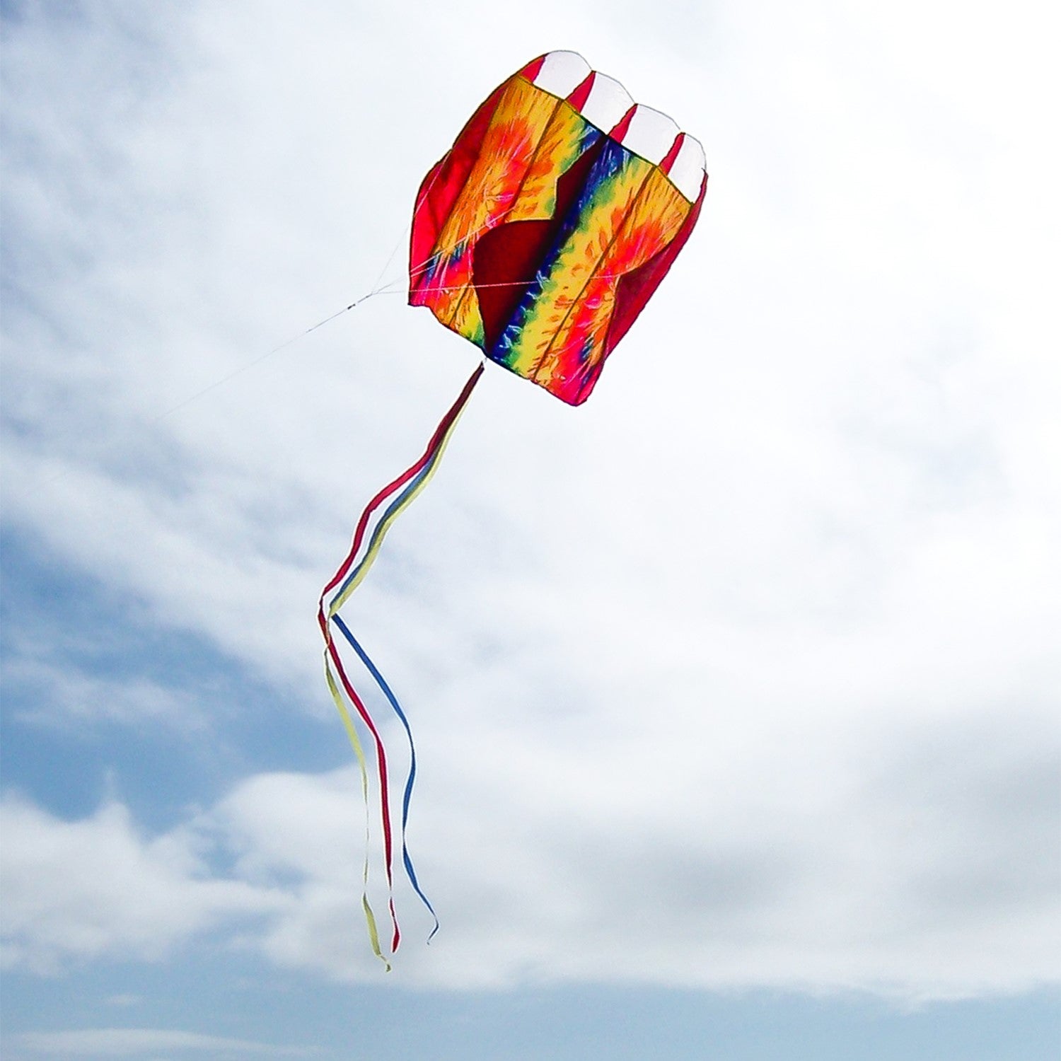 5.0 Tie Dye Red Air Foil Kite soaring in a bright blue sky, showcasing its vibrant colors and aerodynamic structure.