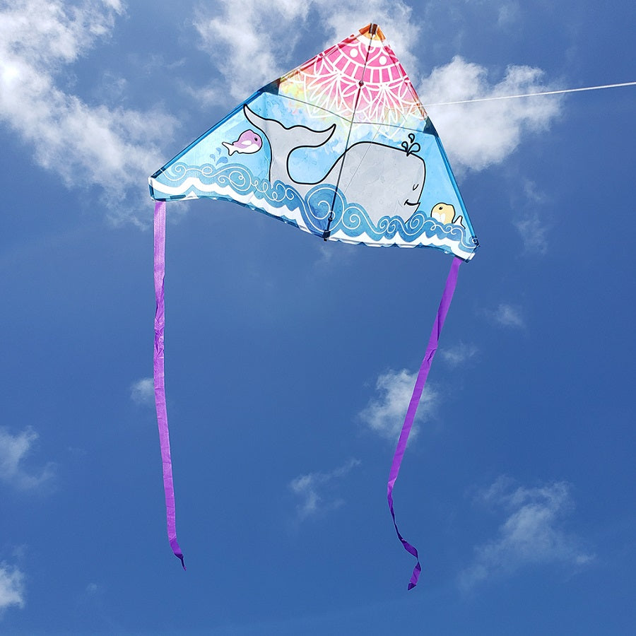 56 in. Delta Kite featuring a Whale Mandala design flying high against a clear blue sky, showcasing the vibrant colors and unique artistic pattern.