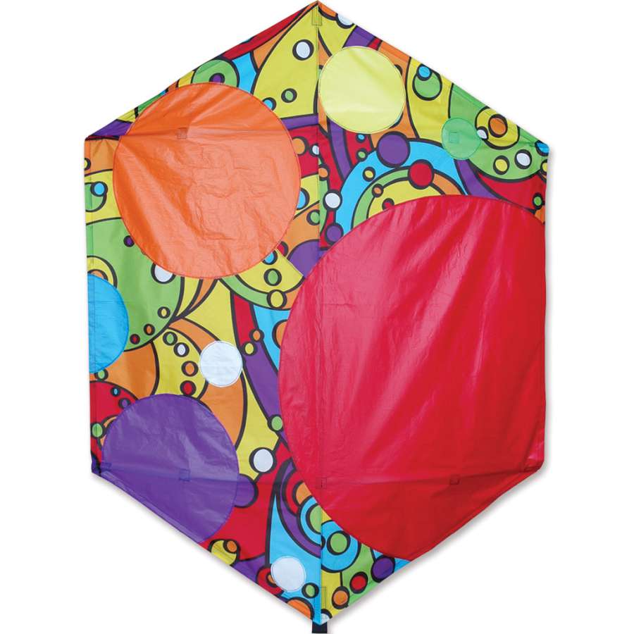 A 56 in. Rokkaku Kite featuring a rainbow bubbles design soaring in the sky against a blue backdrop, displayed with its frame and line.