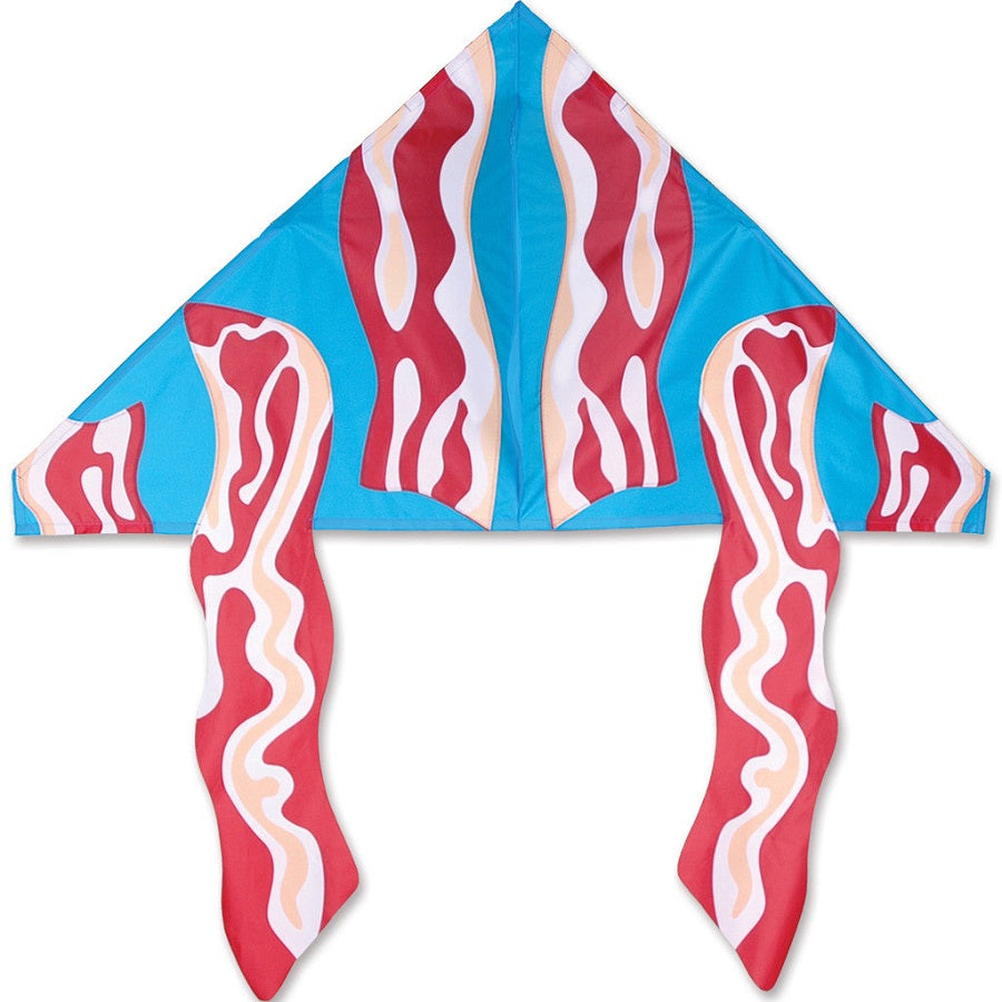 Vibrant 56-inch Delta kite with a bacon design flying in the sky against a clear blue backdrop, showcasing its playful aesthetic.
