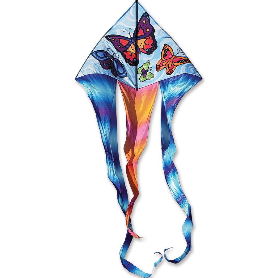 6.5 ft Flo-Tail Delta Kite featuring butterfly design soaring in the sky, displaying its flowing 24-foot tails against a blue backdrop.