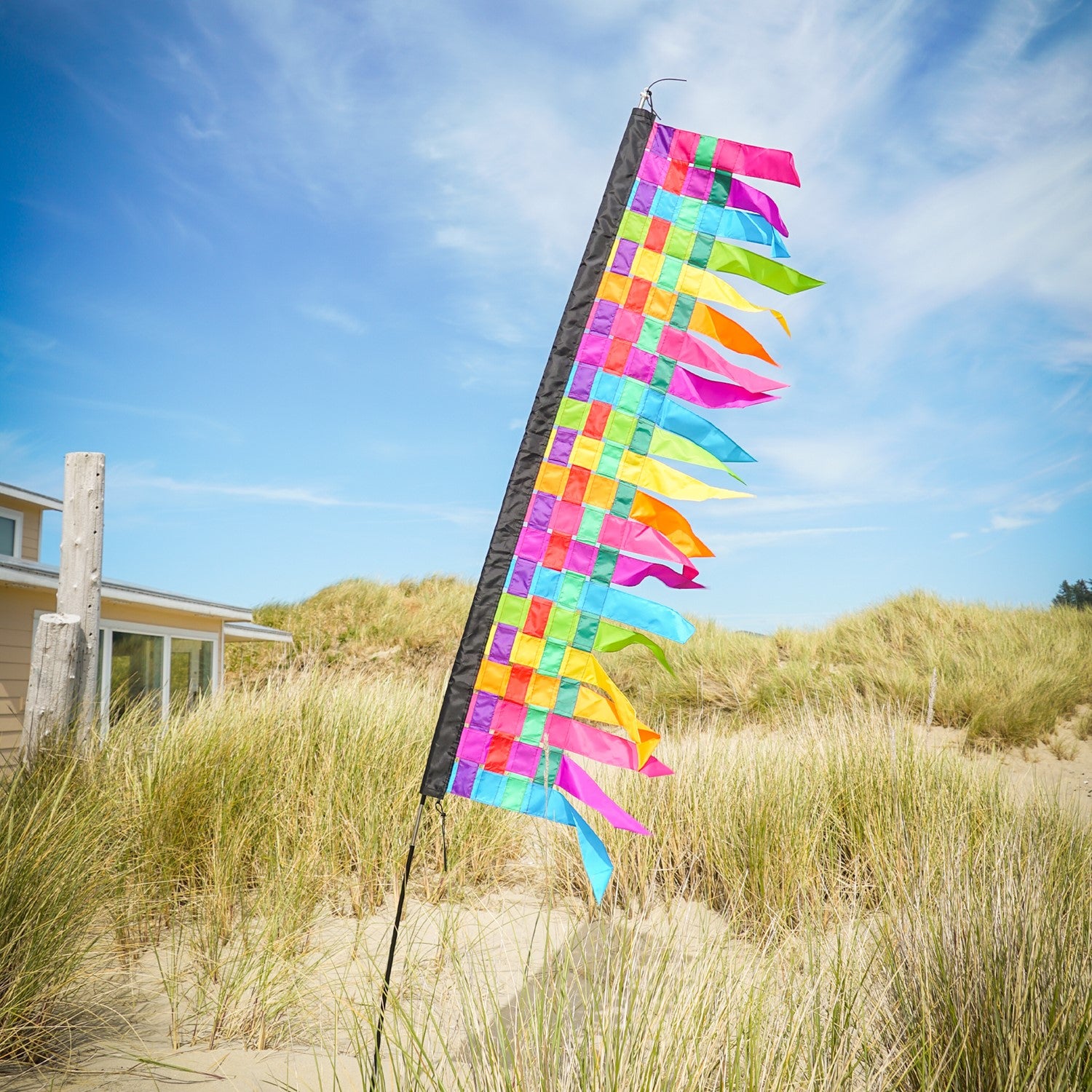6-foot fiesta weave banner featuring interwoven strips of vibrant colors, draping elegantly with tails that sway in the wind, enhancing any event or store.
