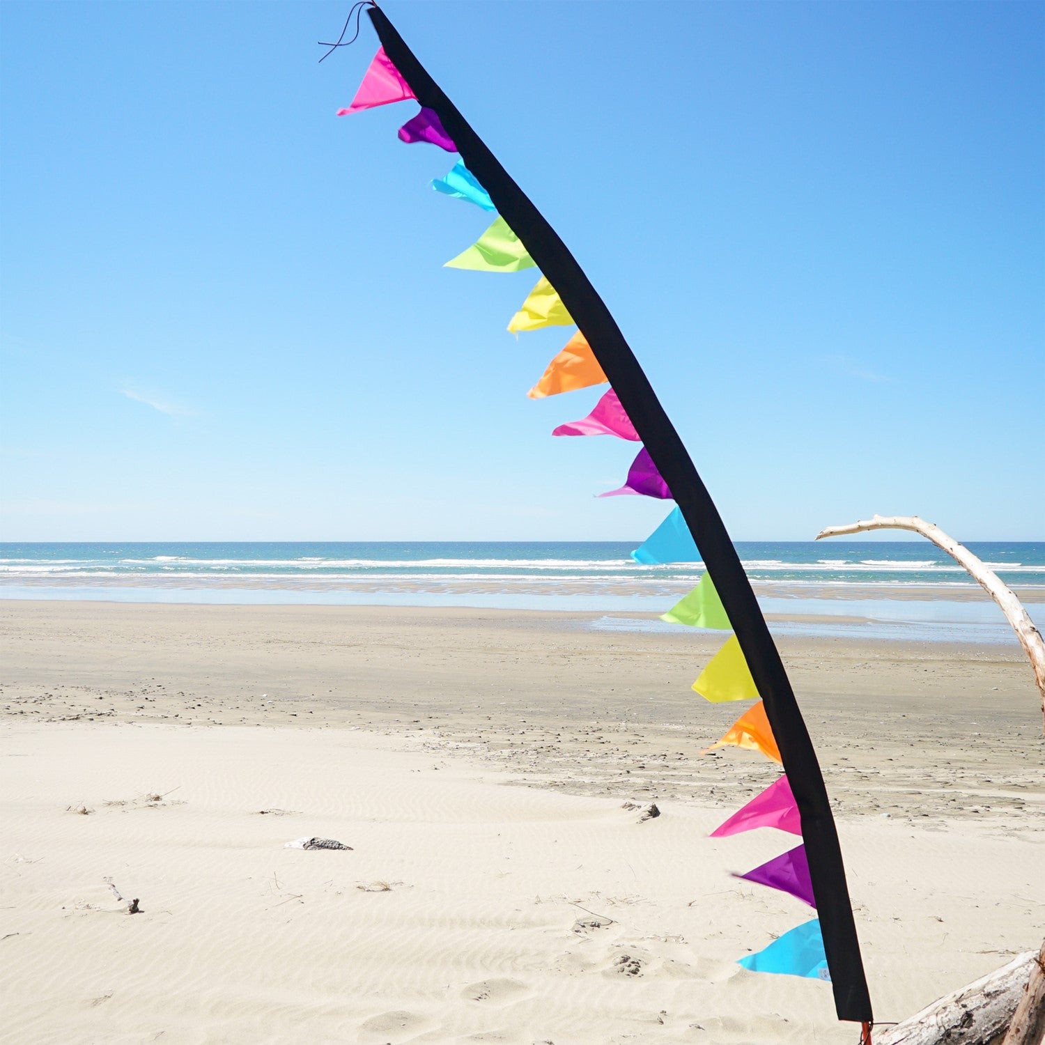 8-foot Fiesta Pennant Banner with 15 colorful triangle pennants hanging in a festive outdoor setting, perfect for celebrations.