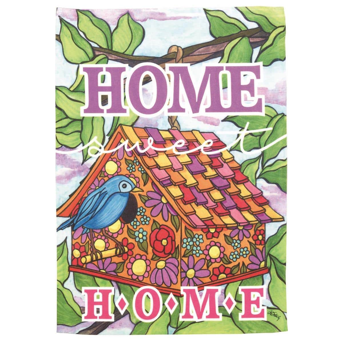 Printed 13x18 garden flag showing a quaint birdhouse with small birds, floral accents, and readable Home Sweet lettering displayed on a yard flag stand beside blooming planters.