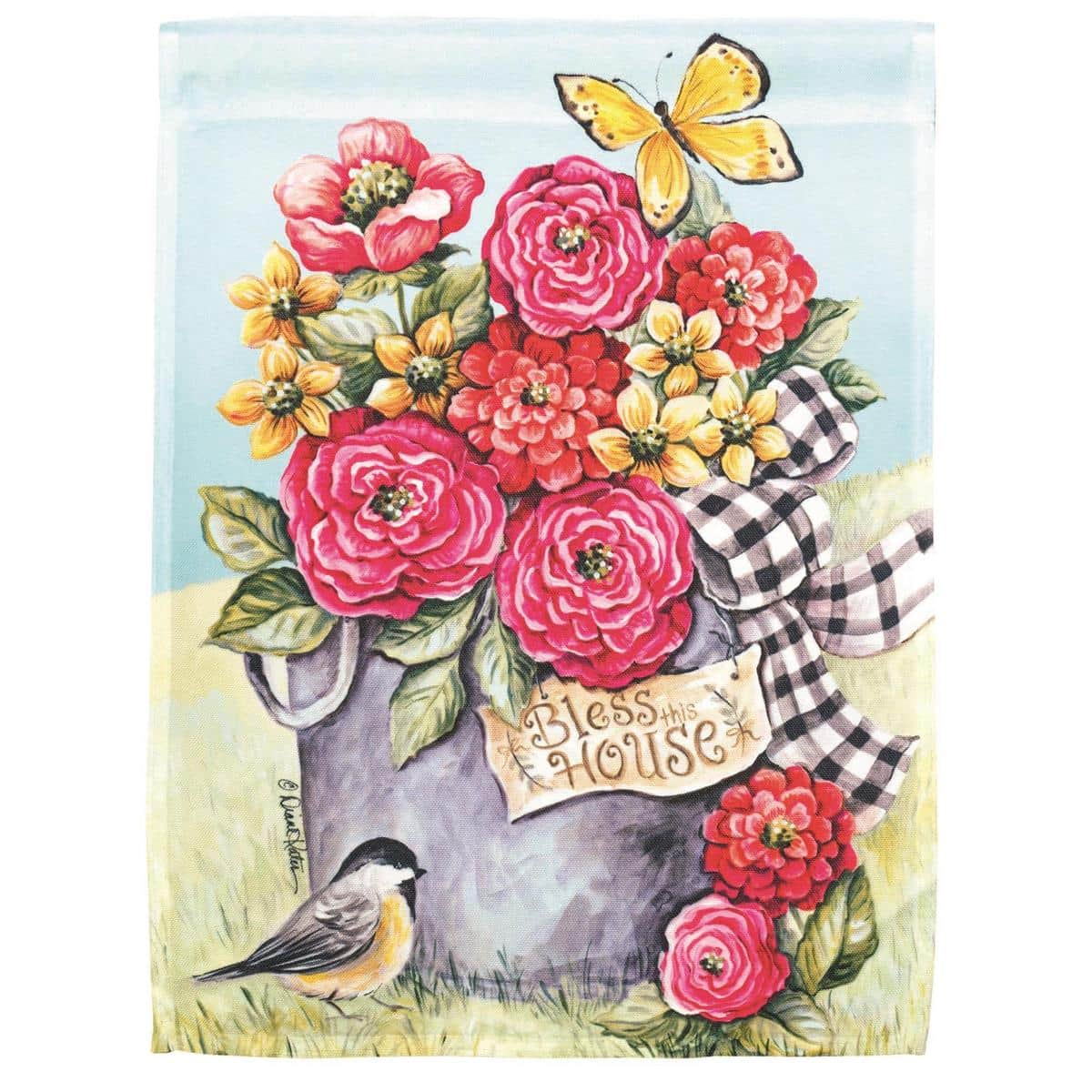 30x44 Bless This House Flowers Banner Flag showing scripted "Bless This House" message surrounded by printed floral arrangements, displayed on a front porch near a door with neutral siding.