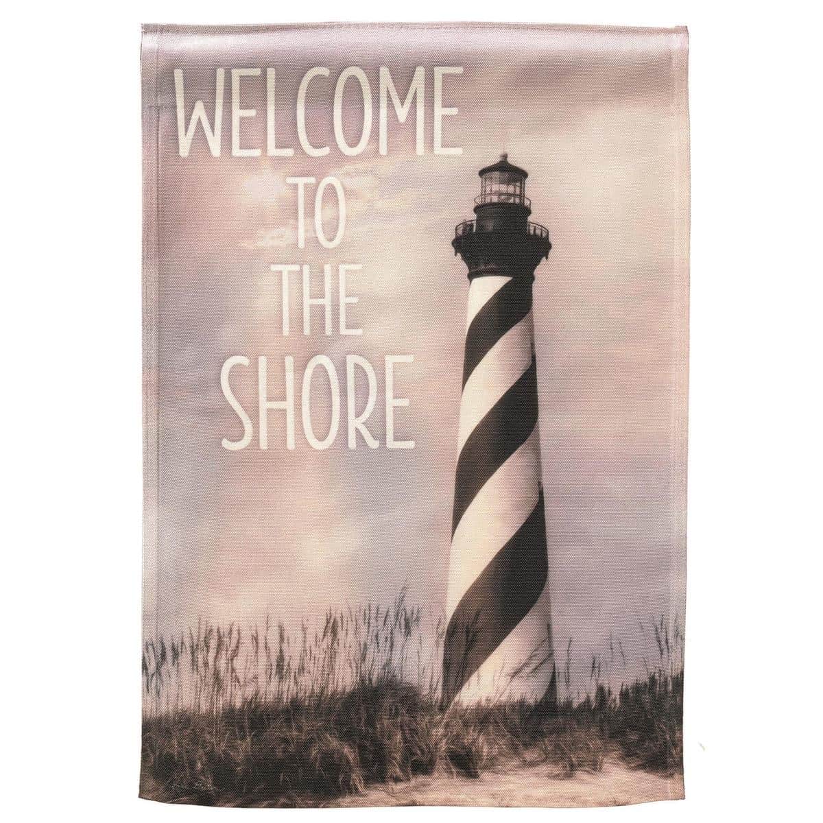 13x18 printed Cape Hatteras Lighthouse garden flag showing black-and-white spiral lighthouse against a blue sky and shoreline, durable polyester fabric with hem and sleeve for standard garden pole