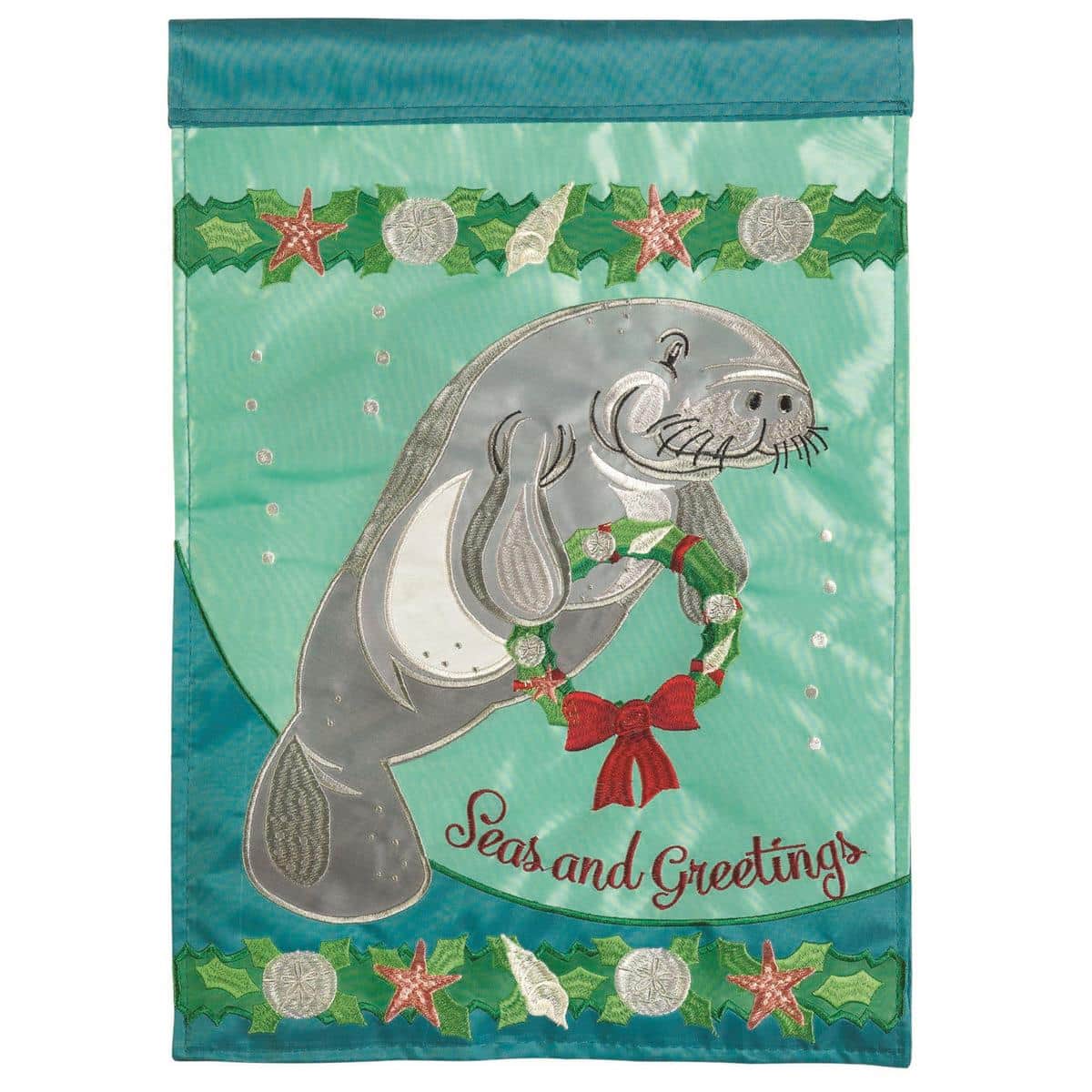 13x18 Christmas manatee garden flag with double-applique manatee wearing a Santa hat and embroidered snowflake accents on durable outdoor fabric, reinforced sleeve for garden pole display.