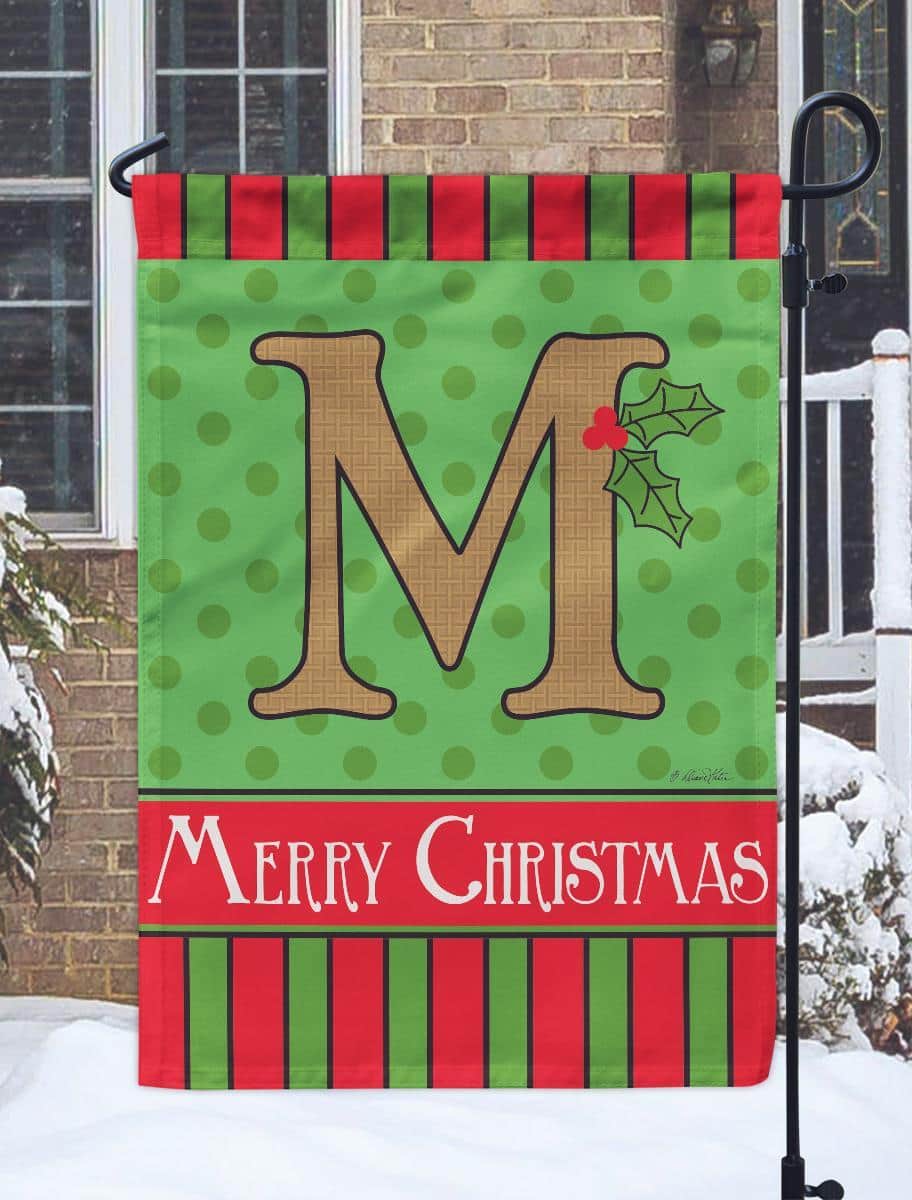 13x18 Christmas Monogram M burlap garden flag with double applique monogram M in wreath and rustic burlap background displayed on a garden flag stand for holiday porch decor