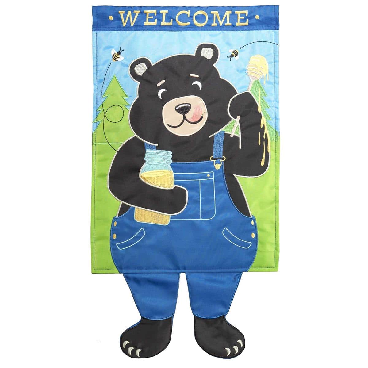 Whimsical black bear with elongated legs and the word Welcome printed on a 13 by 18 inch garden flag, shown mounted on a standard yard pole in a grassy front garden setting