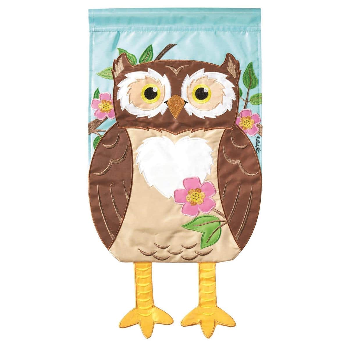 Crazy Leg Owl Garden Flag 13x18 with dangling fabric legs, whimsical bird yard decoration on a standard garden stand beside flowers