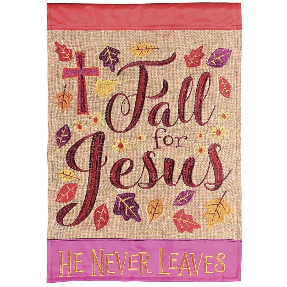 13x18 double applique Fall For Jesus He Never garden flag with autumn leaves and script faith message displayed on a yard flagpole against a garden background.
