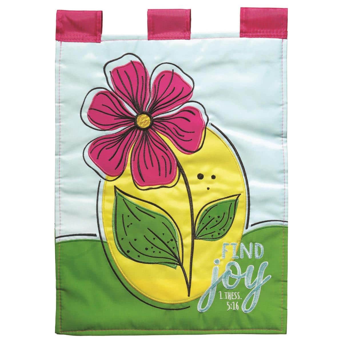 Find Joy InspireFlowr 13x18 garden flag with layered floral appliques and scripted 'Find Joy' message shown on a metal garden flag stand among flowering plants in a sunlit yard.