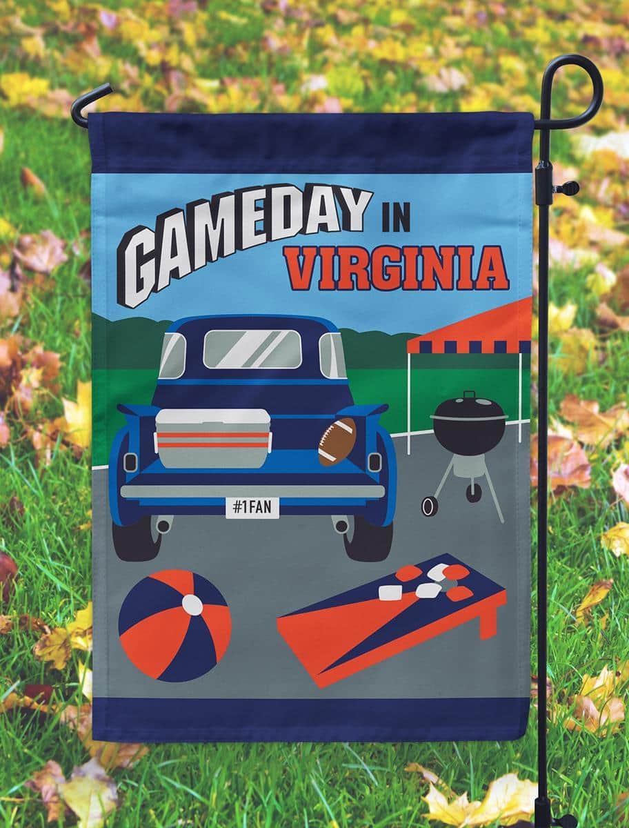13x18 double applique garden flag in navy and orange with stitched team emblem displayed on lawn near a porch and garden stake.