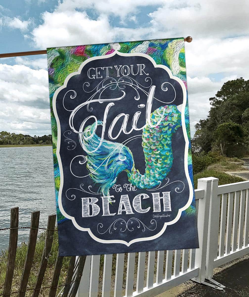 30x44 Get Your Tail To The Banner printed beach banner flag displayed on a porch with bright tropical fish tail artwork and bold playful text.