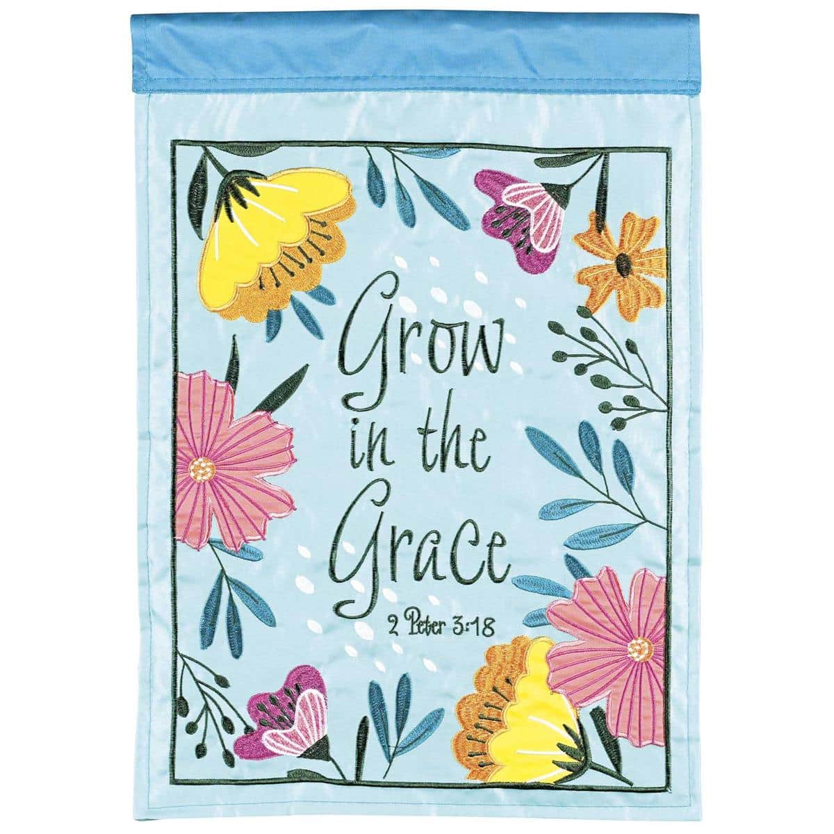 13x18 Grow In The Grace spring garden flag with floral double applique reading Grow In The Grace, displayed on a garden stake in a planted bed.