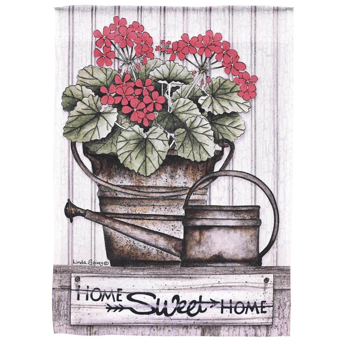 Home Sweet Home Geraniums garden flag 13x18 printed floral design showing red and pink geranium clusters with green foliage framing a warm scripted "Home Sweet Home" message on durable polyester for porch or yard display