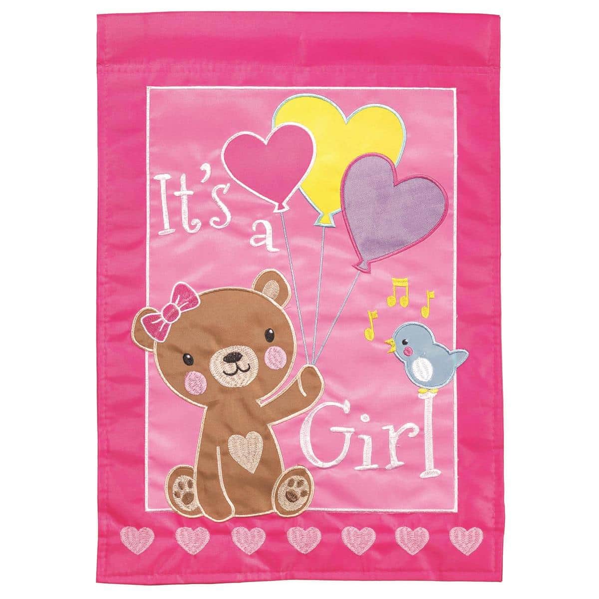 Pink and white Its A Girl bear double applique 13x18 garden flag featuring a smiling teddy bear with a bow and floral accents displayed on a small yard flag stand for porch or lawn use.