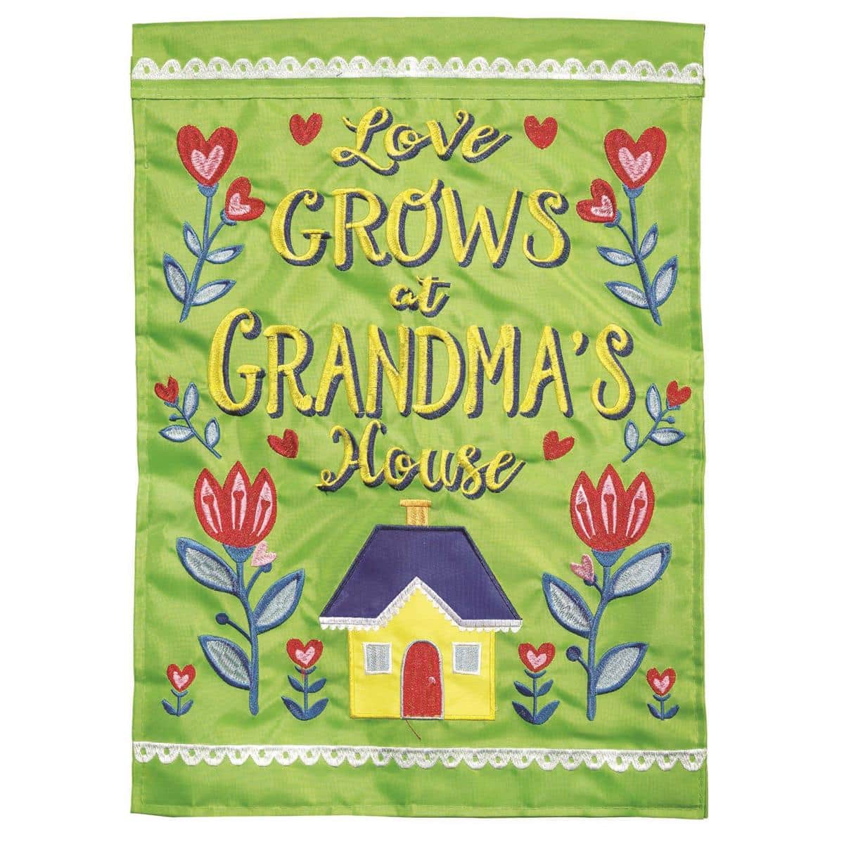 13x18 Love Grows At Grandmas House garden flag in double applique style showing floral accents and Grandma/Nana lettering, displayed on a yard flag stand suitable for porches and paths.