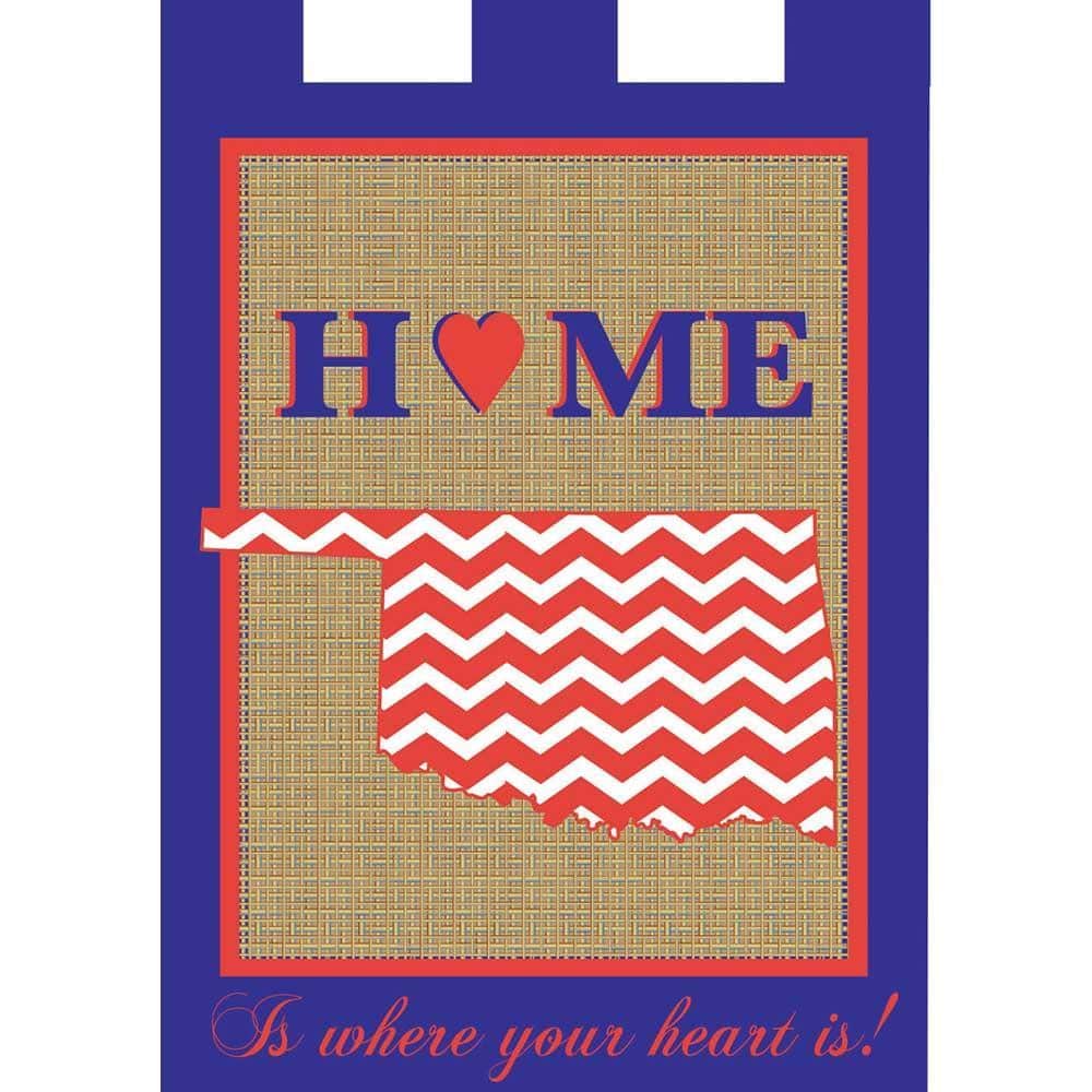 Blue and orange Oklahoma game day garden flag 13 by 18 inches with double applique emblem, displayed on a metal garden flag pole in a residential porch setting.