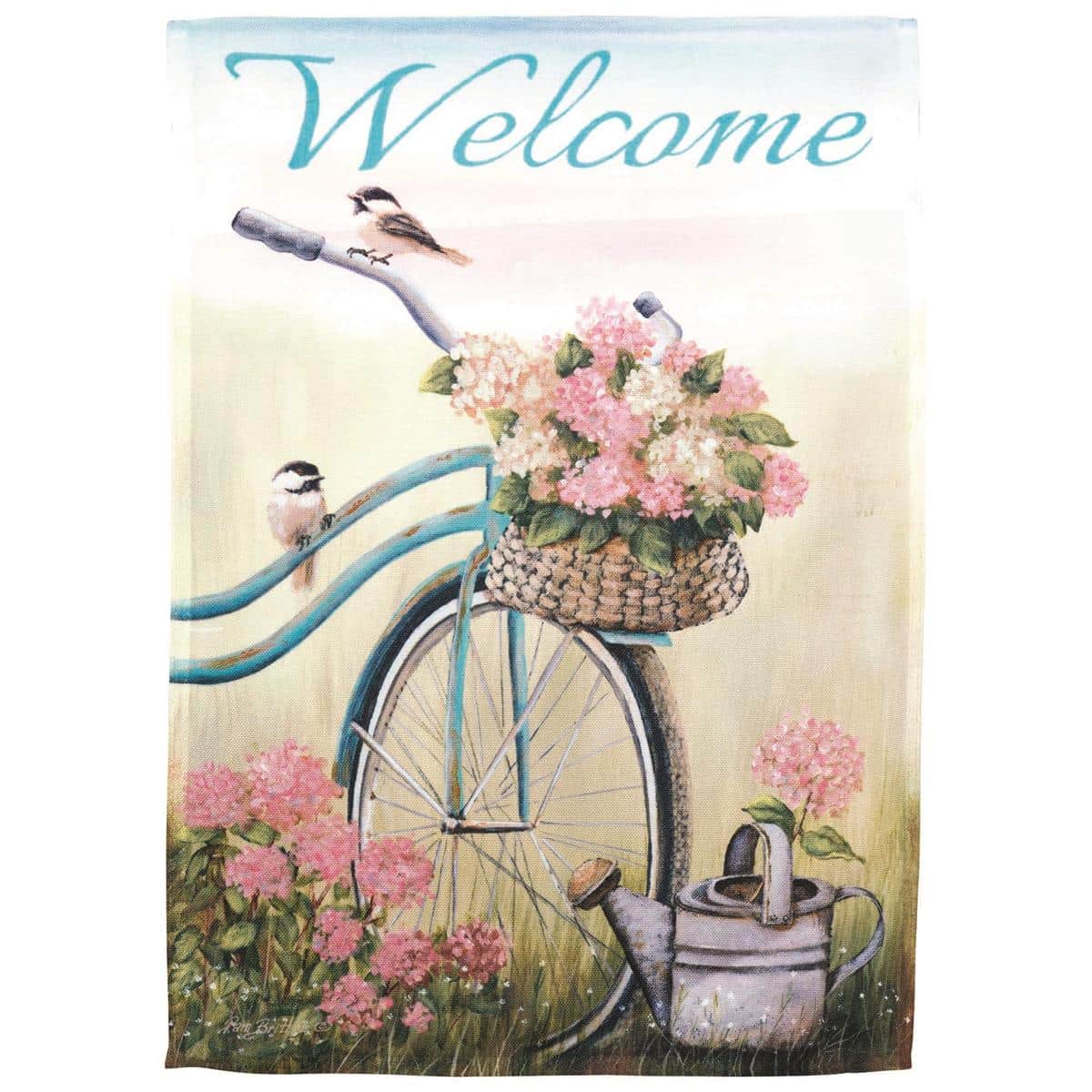 13x18 printed garden flag showing a vintage bicycle silhouette and the word Welcome hanging on a black metal garden flag stand in front of a green lawn and flowerbeds.