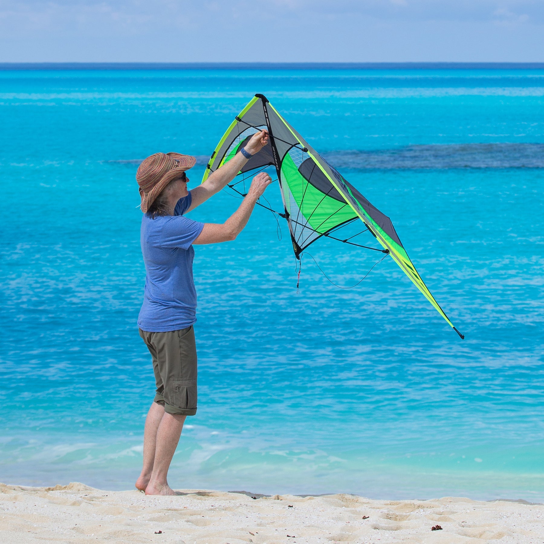 Person Flying Graphite Quantum 2.0 Stunt Kite at the Beach