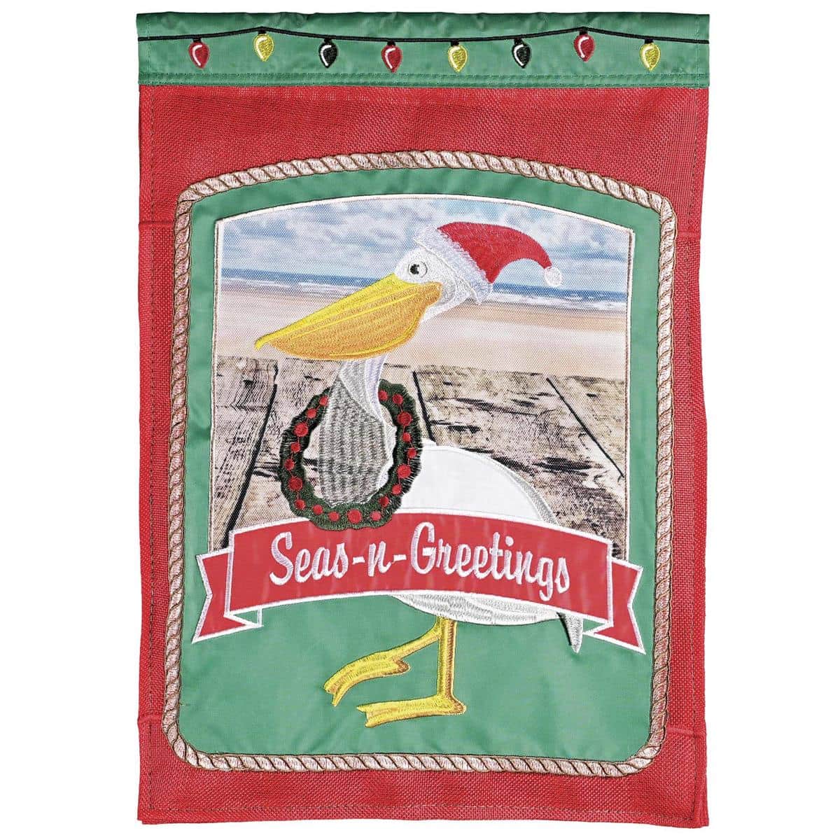 13x18 garden flag showing a coastal pelican motif with seasonal Christmas accents, double-applique-plus layered fabrics and embroidery, suitable for porches, patios, and garden flag poles.