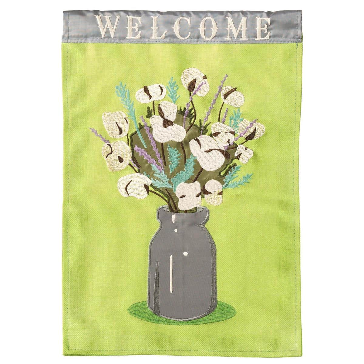 13x18 Southern Cotton Welcome garden flag with double applique Southern design, cotton-look texture and layered fabric details, shown mounted on a porch pole near a traditional front entrance.