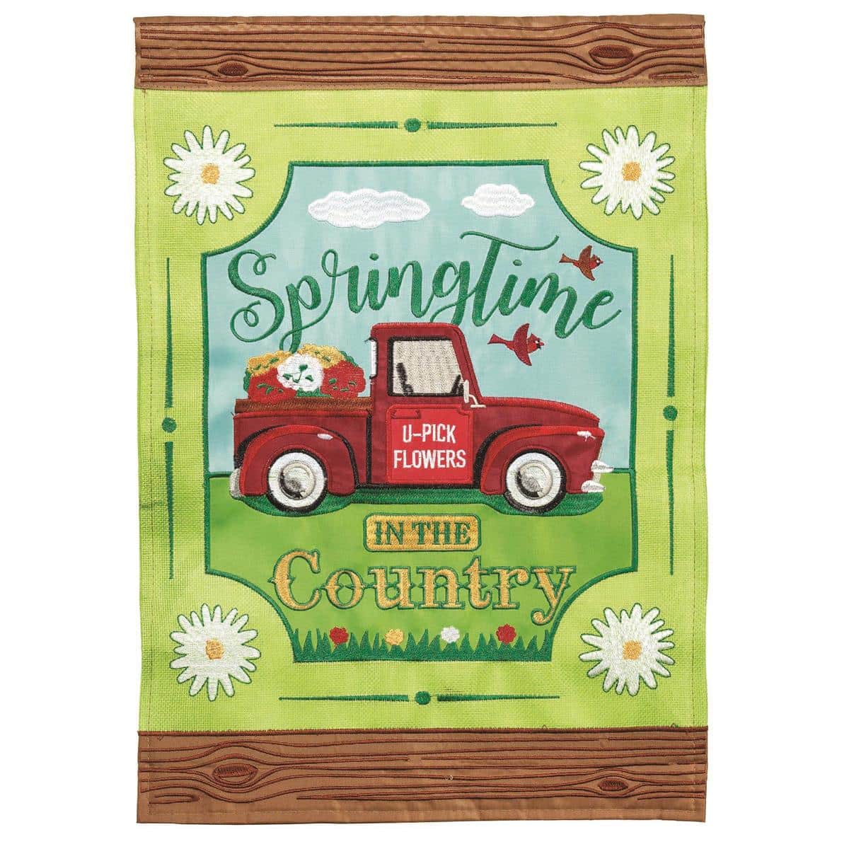 13x18 Springtime In Country burlap garden flag with layered double applique florals and country motifs, shown hanging from a garden flag pole on a porch.