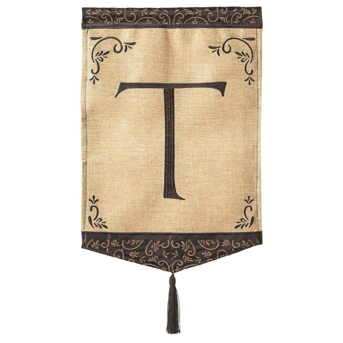 Burlap garden flag with letter T monogram, double applique stitching, tassel detail, 13x18 inch size, displayed on a standard garden flag stand outdoors