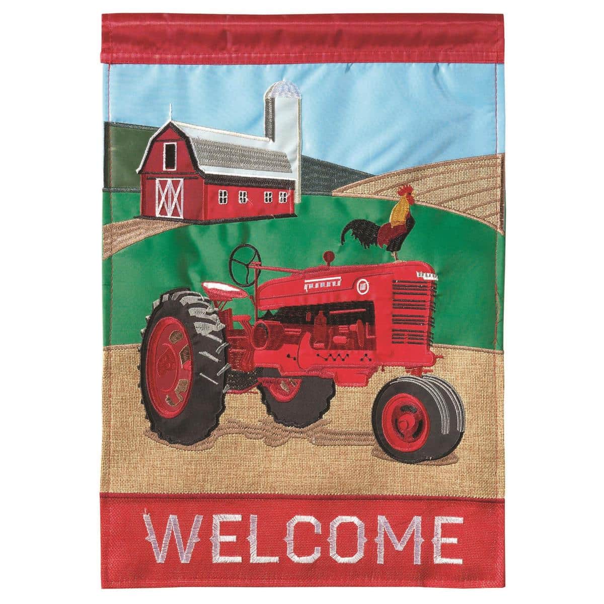 13 x 18-inch Tractor Welcome Burlap garden flag featuring a rustic tractor applique on a burlap-textured background, shown hanging on a standard garden flag pole beside seasonal planters and a welcome mat