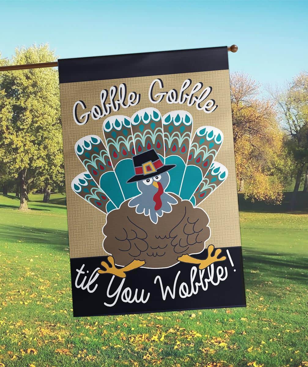29x42 Thanksgiving turkey burlap banner flag with double applique turkey motif on a textured burlap face, reinforced pole sleeve and stitched hem for seasonal porch display