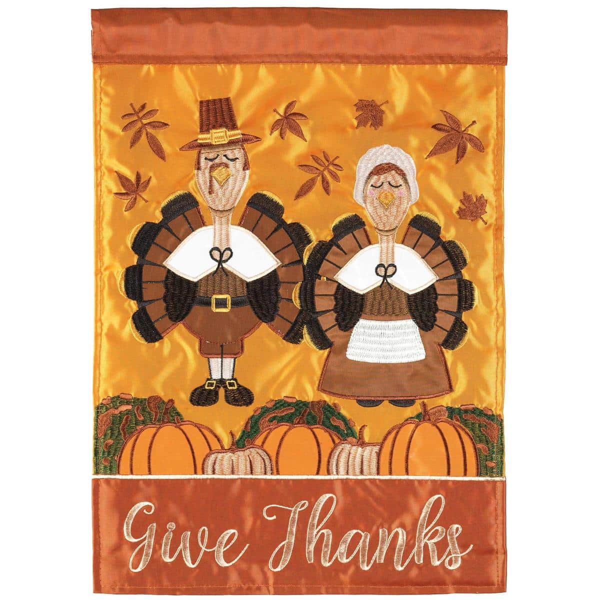 13x18 Turkey Pilgrims Thanksgiving garden flag showing double applique turkey and pilgrim artwork in warm fall colors on a standard garden flag stand in an outdoor yard setting.