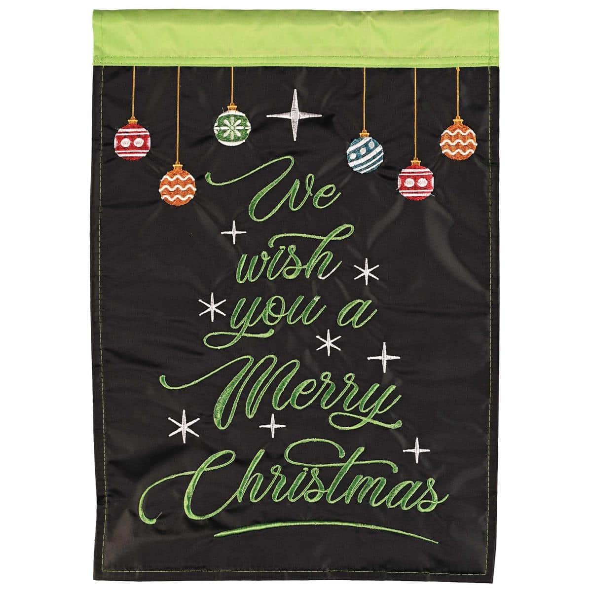 We Wish You A Merry Christmas 13x18 double applique garden flag with holly and berries, scripted greeting in red and green on ivory background displayed on a black metal garden stake in a front yard setting