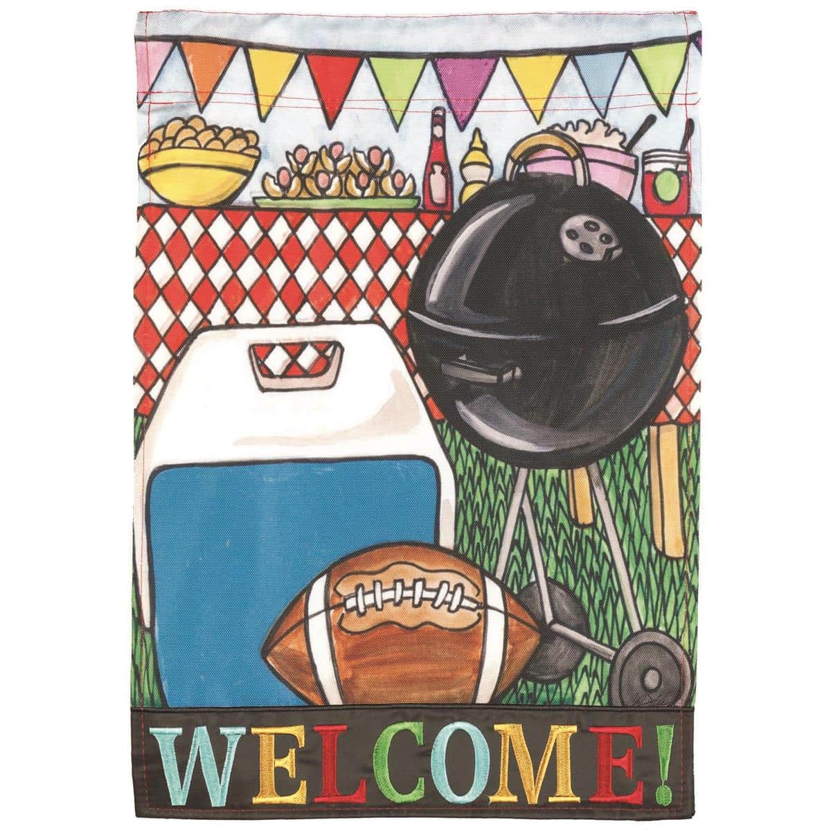 Double-applique 13x18 garden flag with football laces, grill artwork, and a bold Welcome message hanging on a standard stand beside a backyard patio.