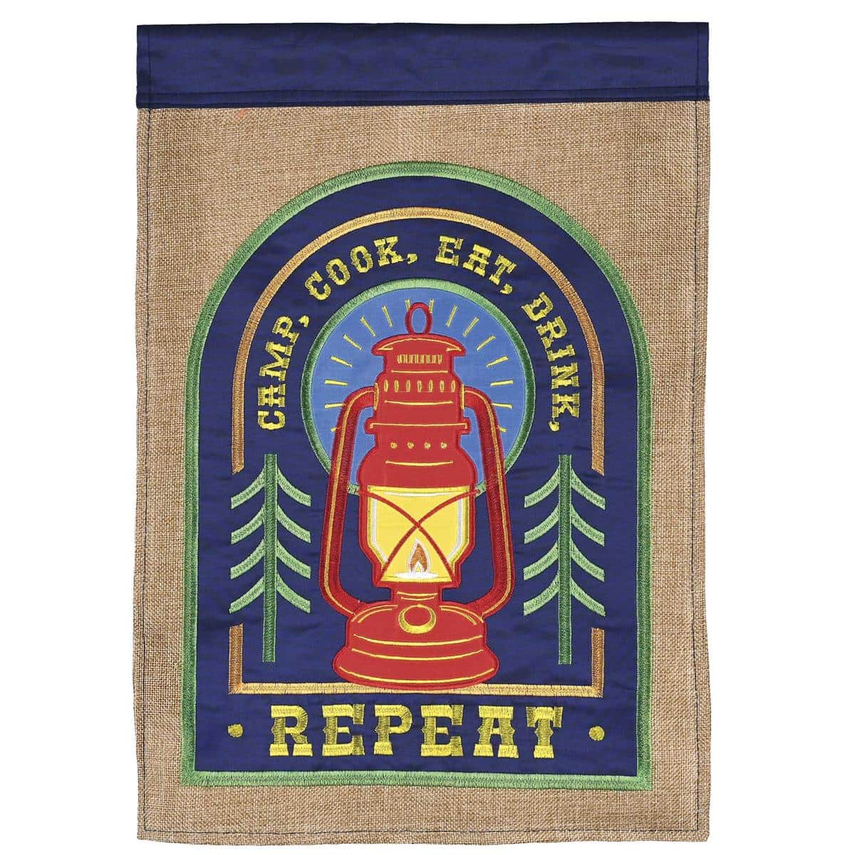 Double-sided Welcome To Our Campsite 13x18 garden flag with camping icons and a reinforced sleeve on a black stand beside a glowing firepit.