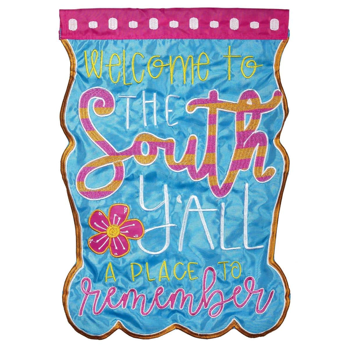 13x18 Welcome To The South garden flag with double applique magnolia motif and scripted "Welcome To The South" greeting shown on a yard stake.