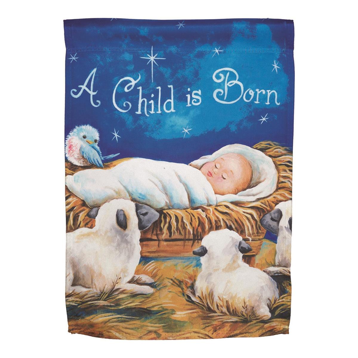 A Child Is Born garden flag featuring a colorful nativity scene painted by Diane Kater, displayed outdoors in a festive garden setting.