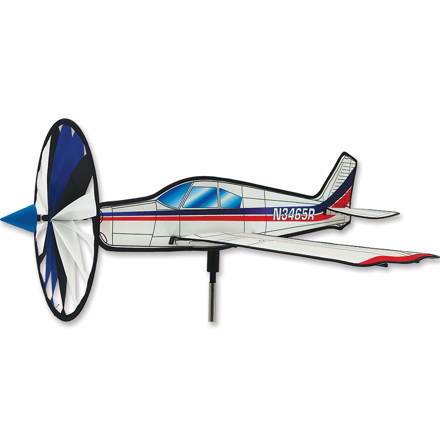 Airplane Spinner - Piper Cherokee lawn ornament spinning gracefully in a vibrant outdoor garden setting, showcasing its detailed craftsmanship.