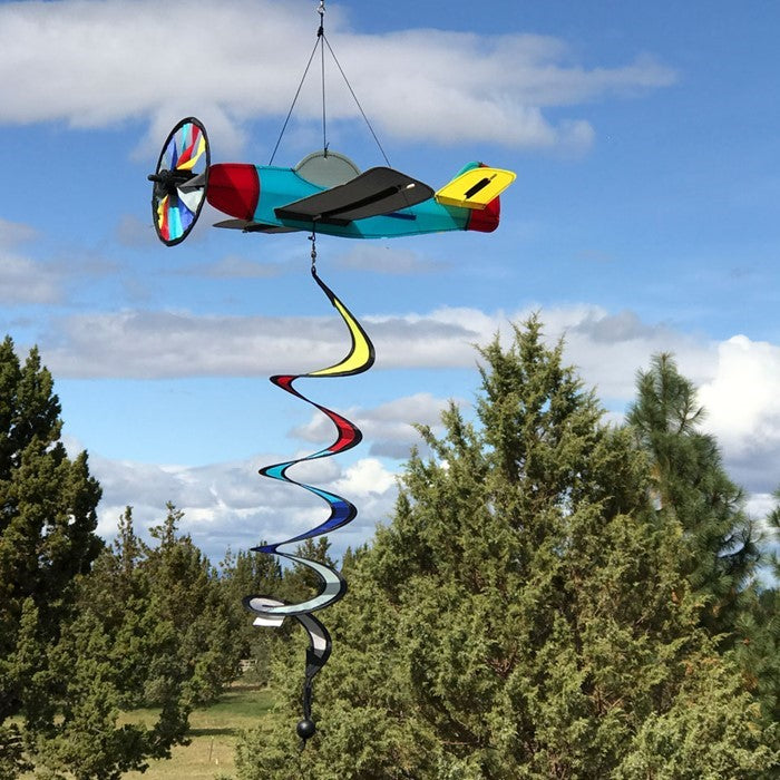 Vibrant Airplane Theme Twister featuring a colorful rotating propeller and curlie tail displayed in a sunny garden setting.