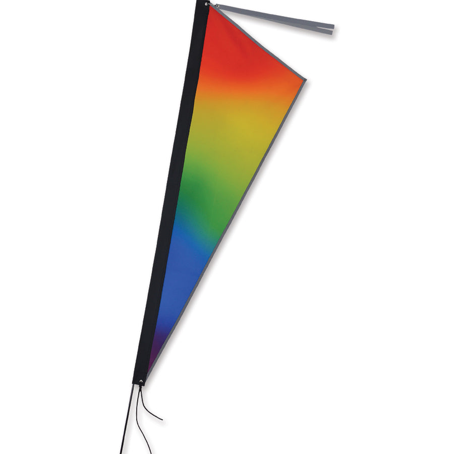 Apex Bike Flag - Rainbow Gradient, a colorful 12x39 inch flag attached to a bike, fluttering against a scenic outdoor backdrop.