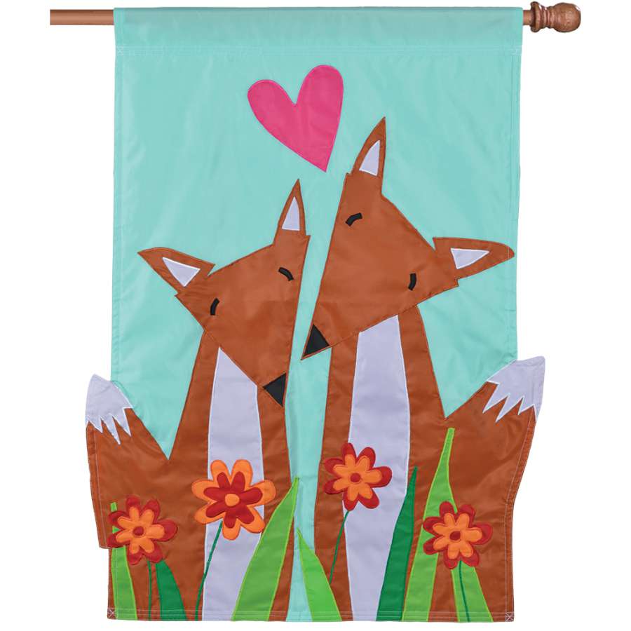 Vibrant Applique Flag - Foxy Pair featuring whimsical foxes displayed outdoors on a flag stand, showcasing double-sided craftsmanship.