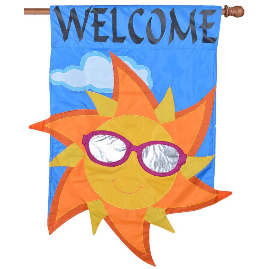 Applique Flag - Welcome Sun features a vibrant sun design, double-sided, displayed in an outdoor garden setting.