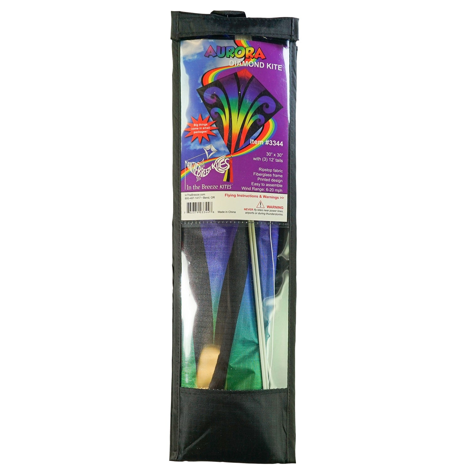 Aurora 30-inch diamond kite featuring vibrant colors and tails, soaring against a clear blue sky, captured in a fun outdoor setting.